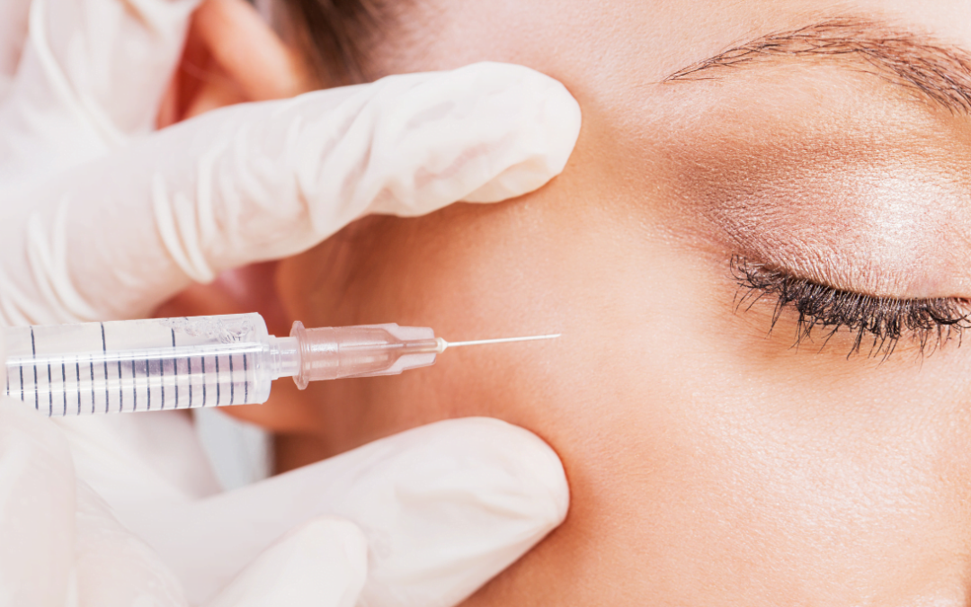 Skilled professional giving a Botox injection for wrinkle reduction on a woman's face