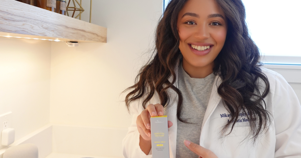 picture of nurse Mikayla of Aluma holding up tinted SPF