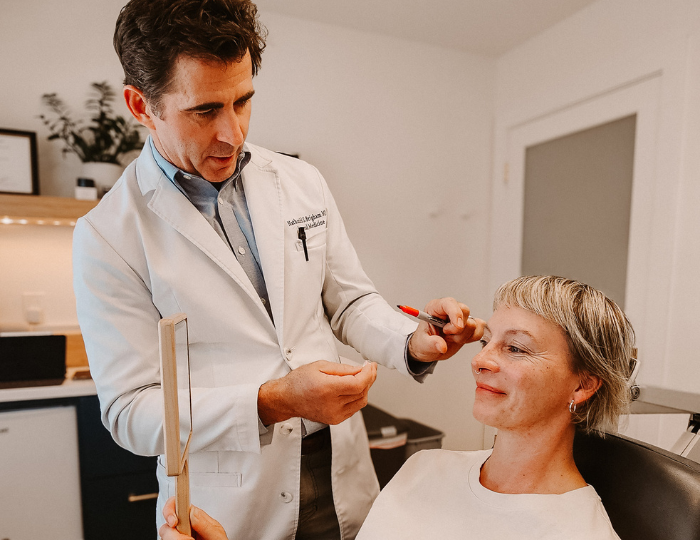 Dr. Brigham of Aluma Aesthetic Medicine performing Injectable Filler consultation