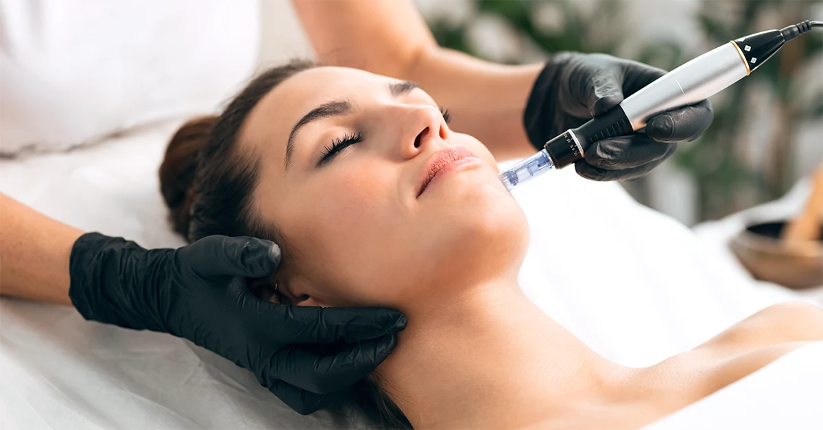 woman receiving microneedling treatment from aesthetician at aluma medspa portland oregon